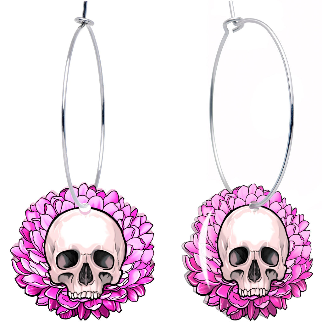 A pair of dangle hoop earrings featuring a skull centered within a pink flower design