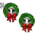 Wooden stud earrings featuring a green Christmas wreath with a red bow and a vampire fang design in the center.