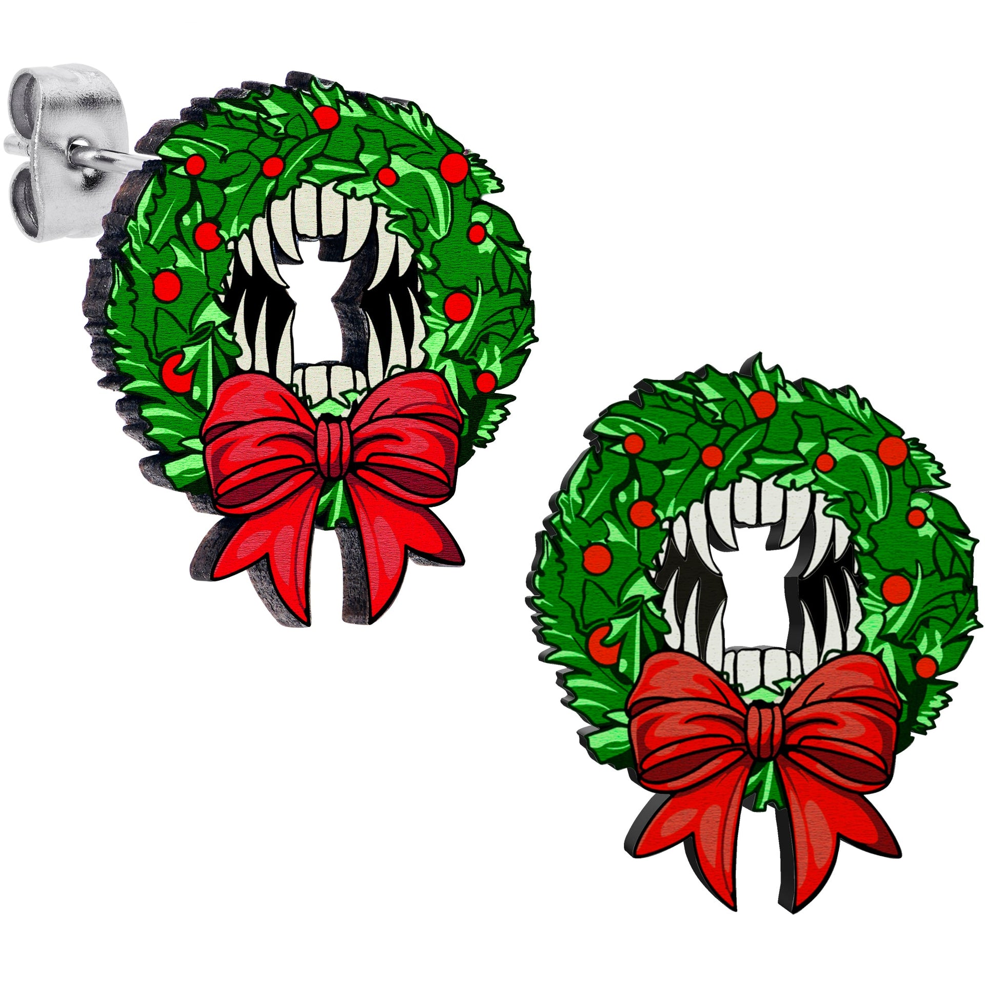 Wooden stud earrings featuring a green Christmas wreath with a red bow and a vampire fang design in the center.