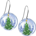 A pair of round dangle earrings featuring a snowy Christmas tree scene inside a snow globe design with stainless steel earwires.
