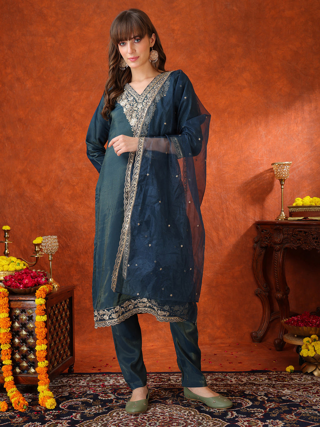 Teal Chanderi kurta with sequin embroidery paired with an embroidered organza dupatta.