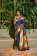 Navy blue Paithani silk saree featuring intricate zari weaving and a matching blouse