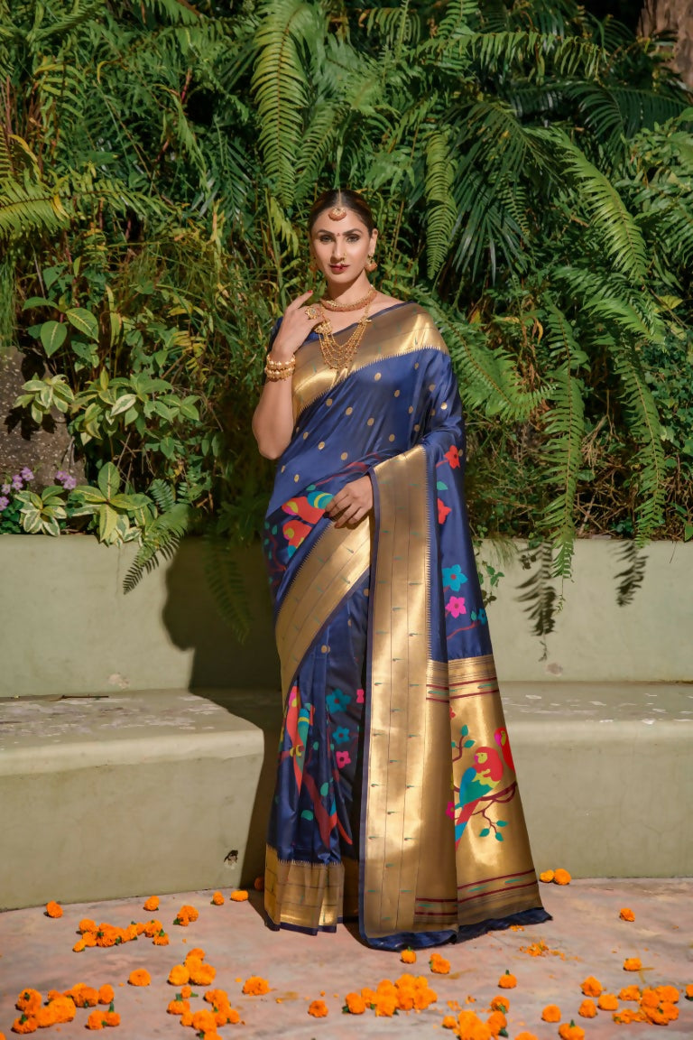 Navy blue Paithani silk saree featuring intricate zari weaving and a matching blouse