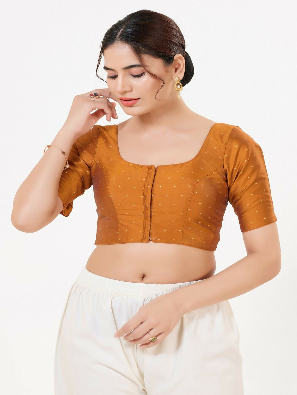 Dark-mustard taffeta silk blouse with round neck, sleeveless cut, and front-open design.