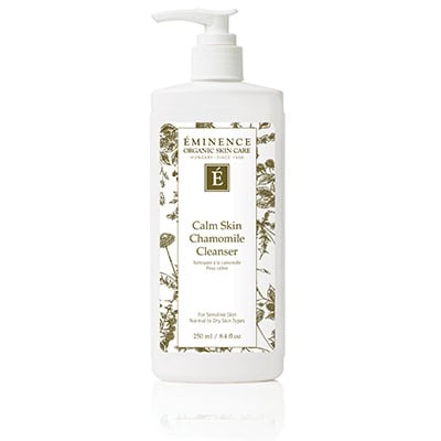 White and green packaging of Eminence Calm Skin Chamomile Cleanser for sensitive skin.