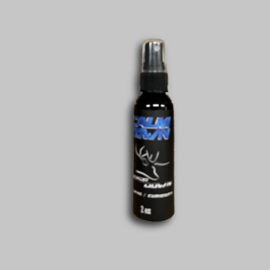Calm Down Spray 2oz bottle featuring a sleek black design with blue text branding.