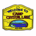 Camp Crystal Lake enamel pin featuring a forest theme, measuring one inch across.