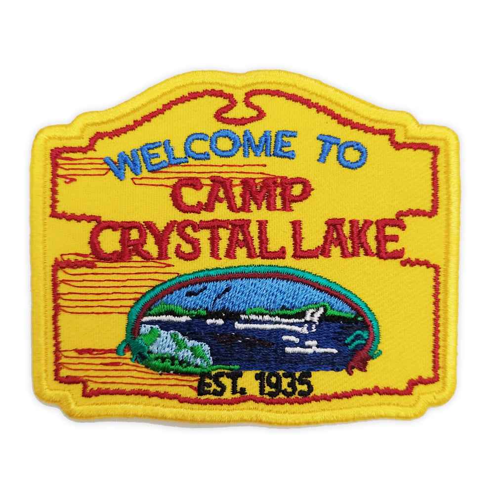 Camp Crystal Lake circular embroidered patch on a denim fabric background