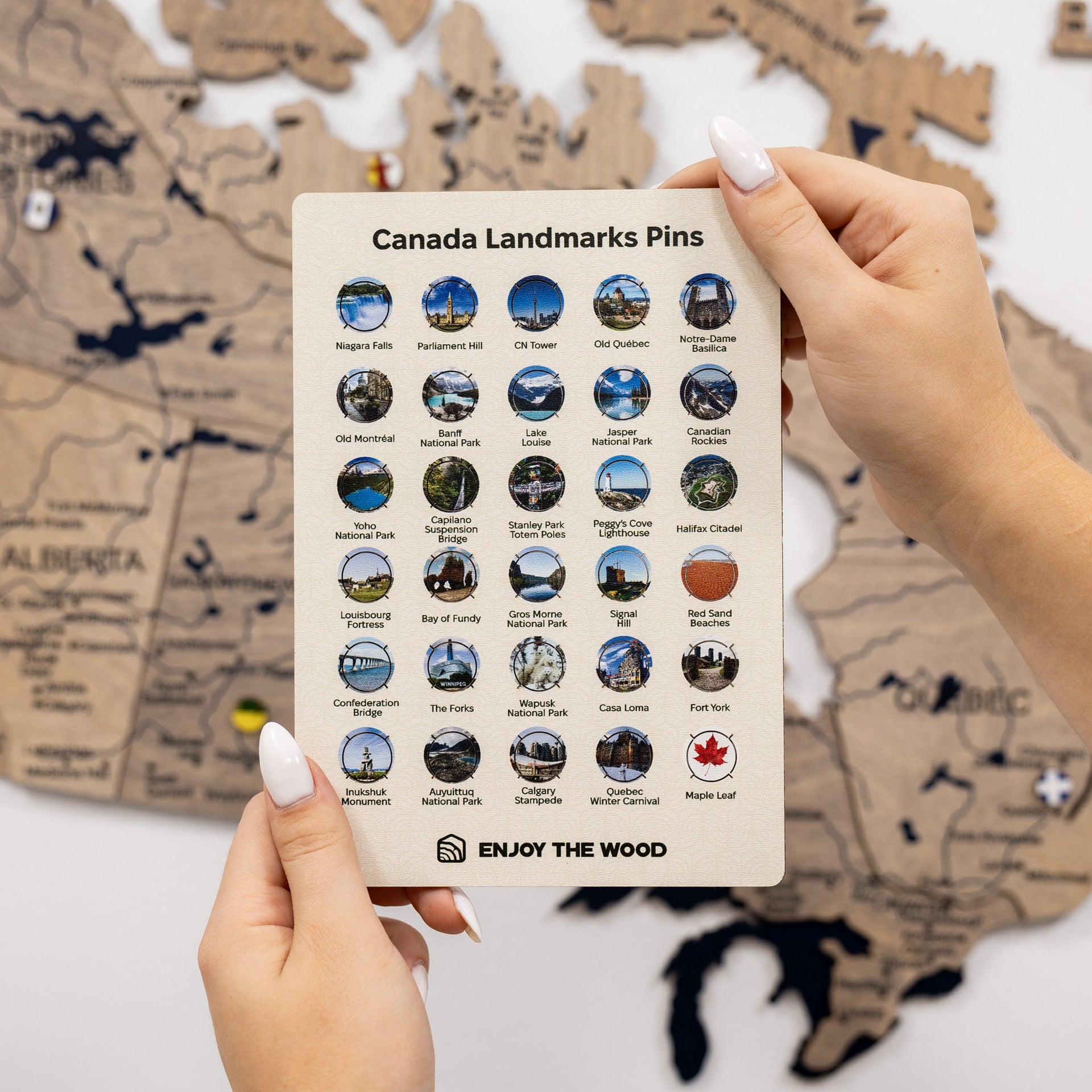 A set of wooden Canada Landmarks pins including the CN Tower and Niagara Falls for wall maps.