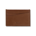 Top-grain Italian leather Card Sleeve in Saddle color, front view showing slim profile and card slots.