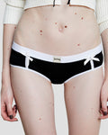 Black and white Kitty Girl Boyshort with pearl-topped satin bows and contrast trim