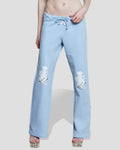Pastel blue wide-leg sweatpants featuring dancing teddy cowboy embroidery and a satin bow drawstring detail.