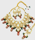 Handcrafted gold-plated Kundan jewelry set with intricate stone-studded design