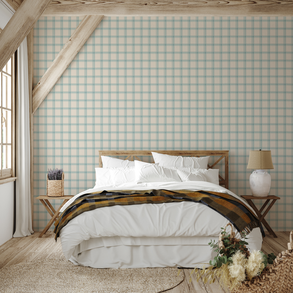 Close up of cream and blue plaid pattern wallpaper on a wall in a modern farmhouse style room.