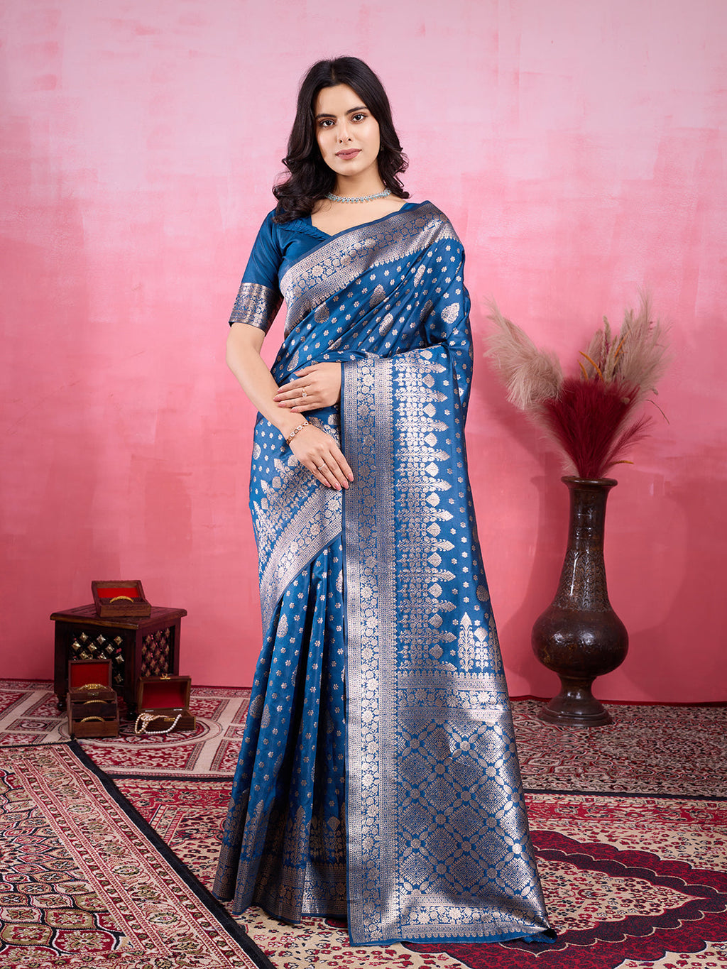 A beautiful Rama blue Banarasi silk saree with intricate golden jacquard zari patterns.