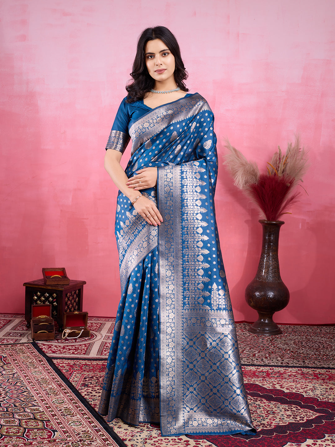 A beautiful Rama blue Banarasi silk saree with intricate golden jacquard zari patterns.