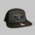 Goose Down 7-panel flat bill camo snapback hat available in grey, black, tan, brown, and green.