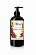 A black pump bottle of Affinati Cherry Noir liquid hand soap with floral and cherry label artwork.