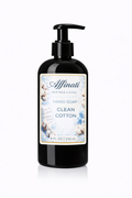 A black pump bottle of Clean Cotton scented liquid hand soap featuring a label with cotton flower imagery.