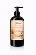 A black pump bottle of Affinati Salted Caramel liquid hand soap on a white background.