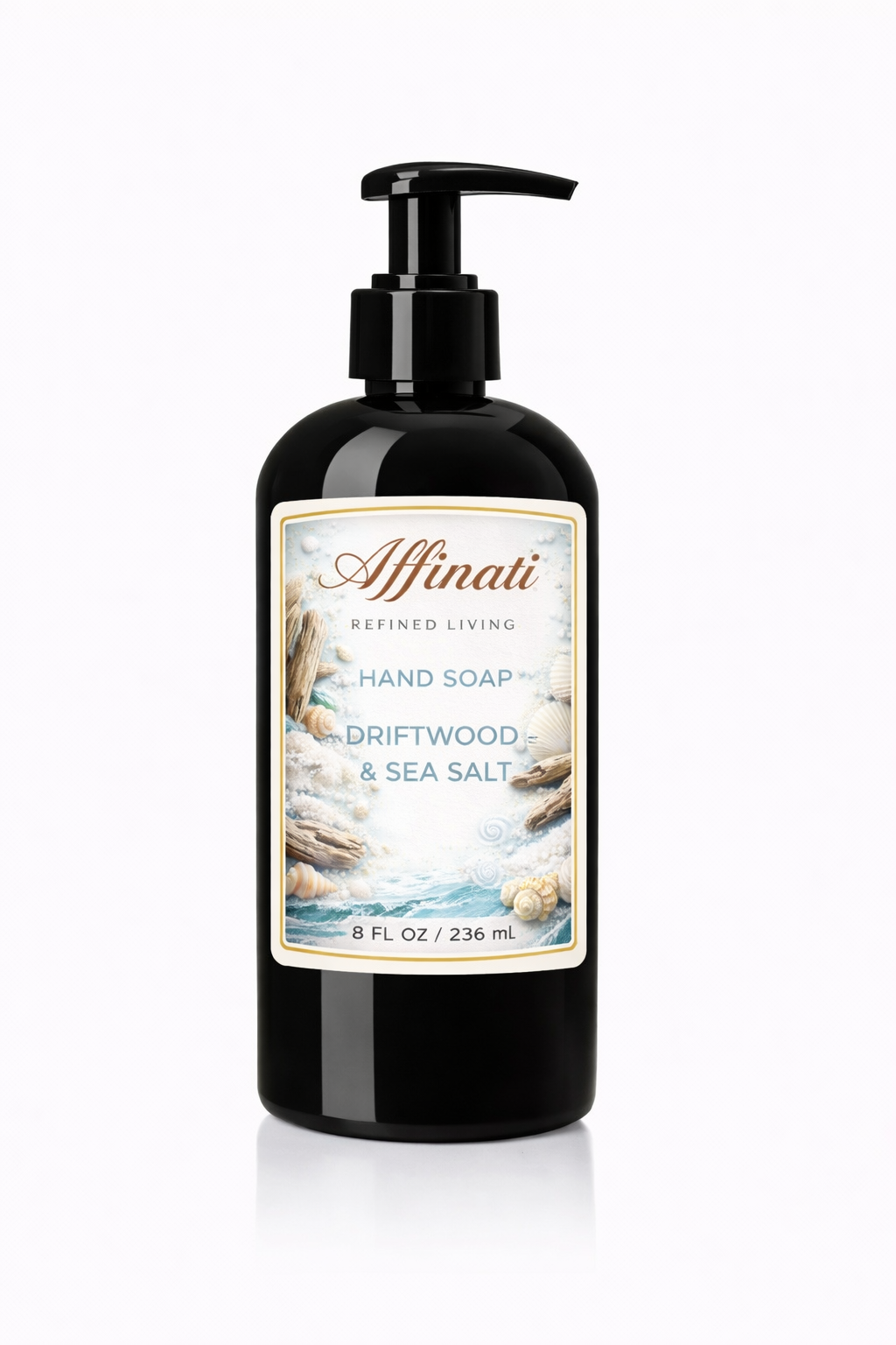 A black pump bottle of Affinati Driftwood and Sea Salt hand soap with a label showing shells and driftwood.