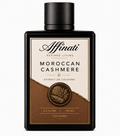 A 100 ml bottle of Moroccan Cashmere Extrait de Cologne in minimalist black, cream, and brown packaging.