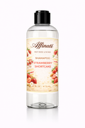 A clear bottle of Affinati Strawberry Shortcake Shampoo featuring a label with strawberry shortcake illustrations, 16 oz size.