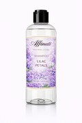 A 16 oz bottle of Lilac Petals shampoo featuring a floral label with purple lilac flowers against a white background.