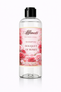 A clear plastic bottle of Bouquet of Roses shampoo with a rose floral label design and black cap.