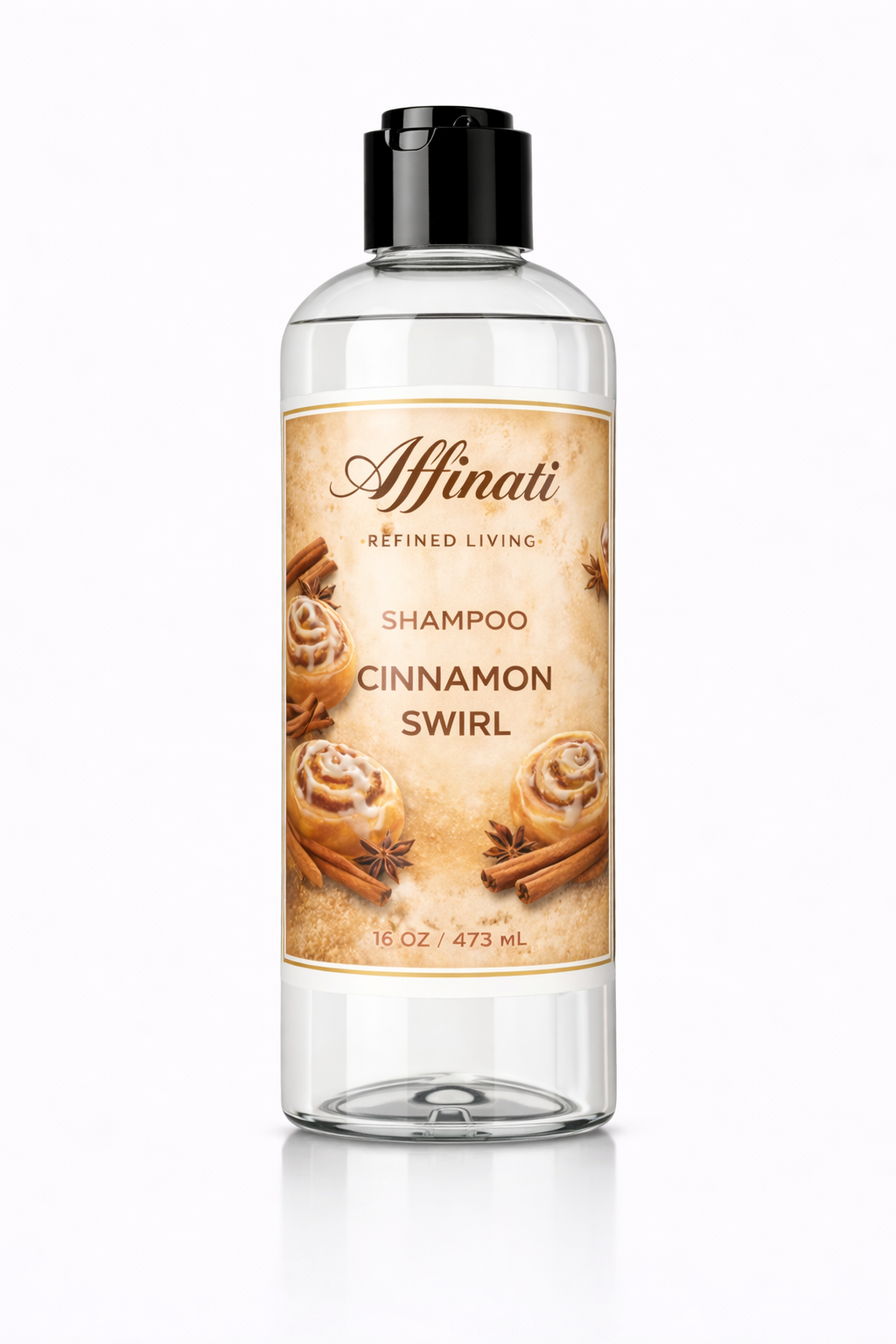 A clear plastic bottle of Cinnamon Swirl Shampoo with a black cap, featuring a label with cinnamon rolls and cinnamon sticks.