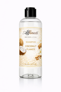 A 16 oz clear bottle of Affinati Coconut Flakes Shampoo with a black cap, featuring a label with coconut and flower imagery.