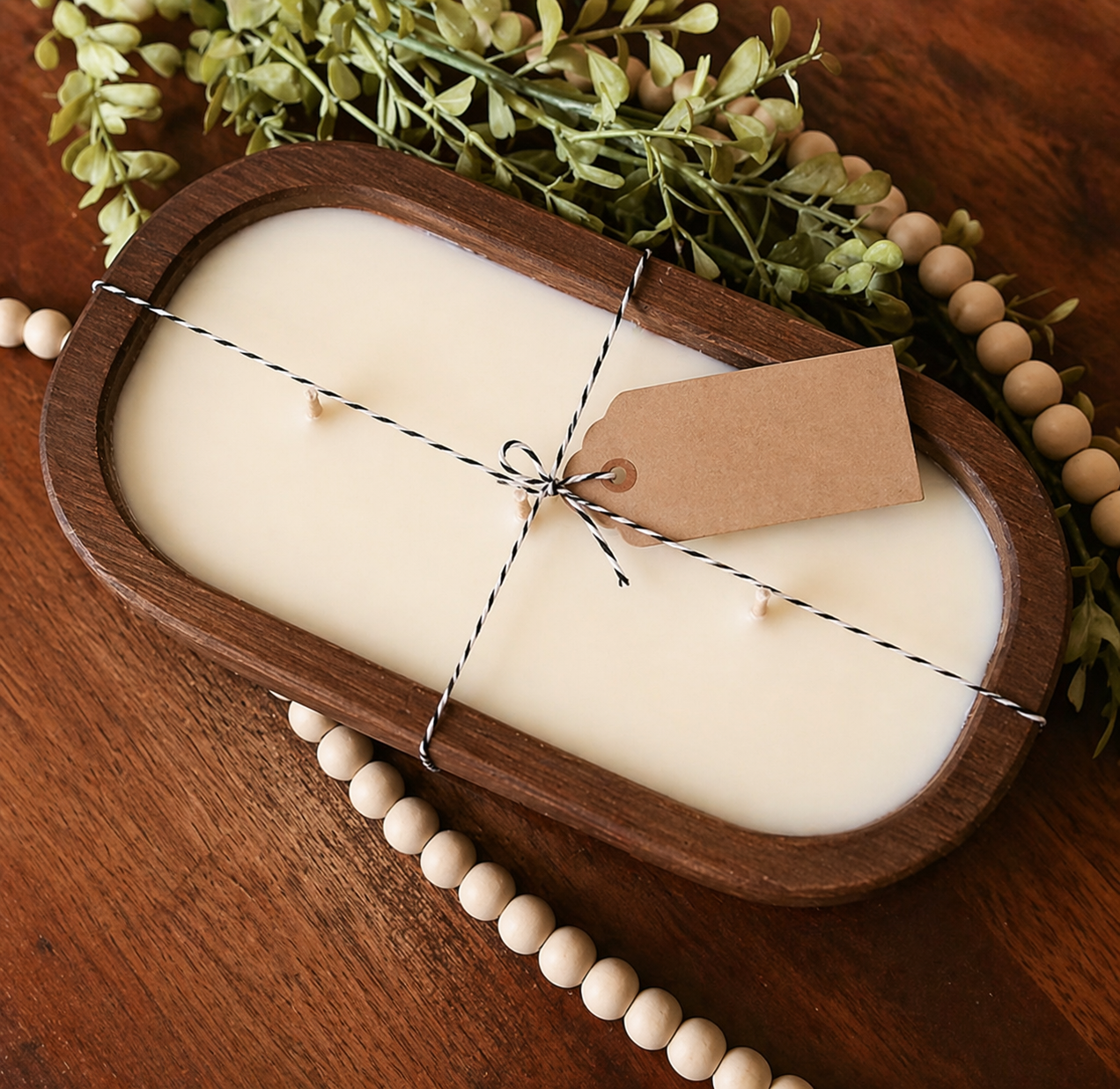 Rustic brown and white hand-carved wooden dough bowl candle for farmhouse decor.