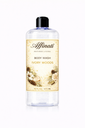 A 16 oz bottle of Affinati Ivory Woods Body Wash on a white background with botanical floral and pinecone label design.