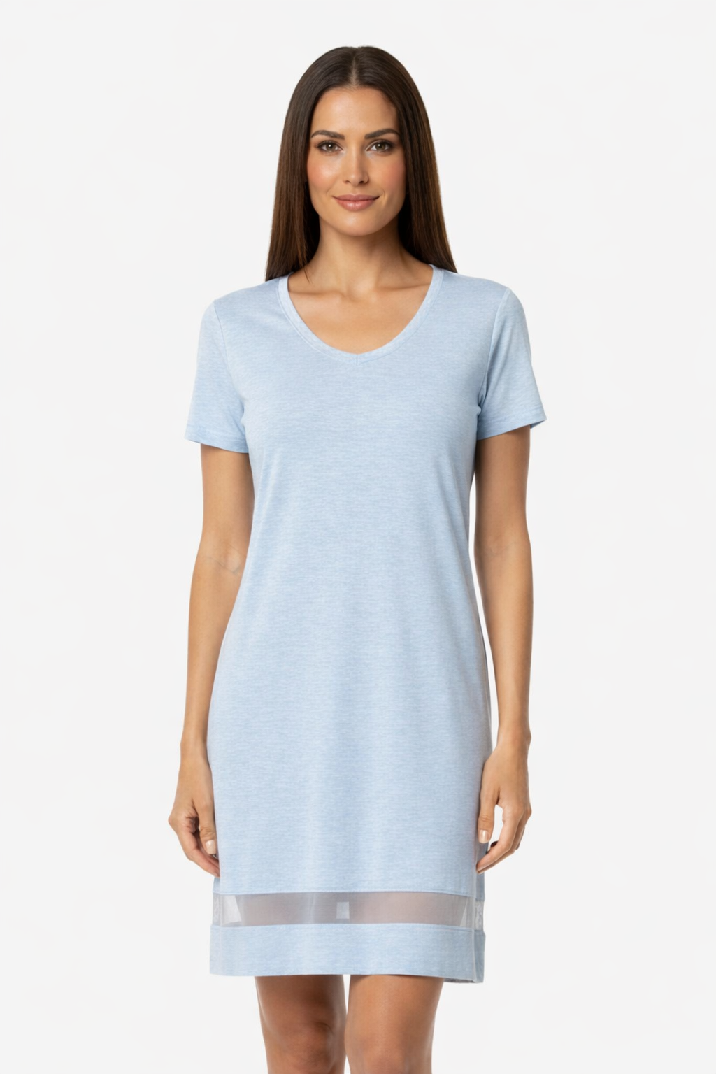 A woman wearing a light blue short-sleeved Gabriela nightgown with a mesh hem detail.