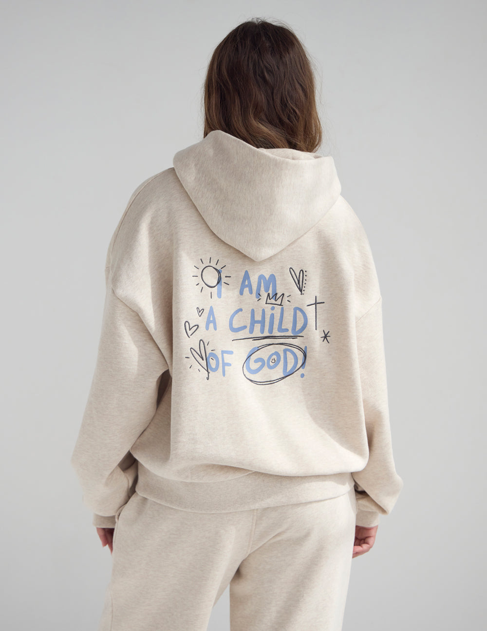 Eggshell full-zip hoodie in 100% cotton with a relaxed fit and minimalist design.