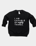 Kids wearing a soft cotton knit pullover with the phrase I am Capable of Mighty Things