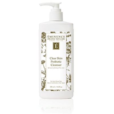 Eminence Clear Skin Probiotic Cleanser in a white pump bottle with dark green botanical label.