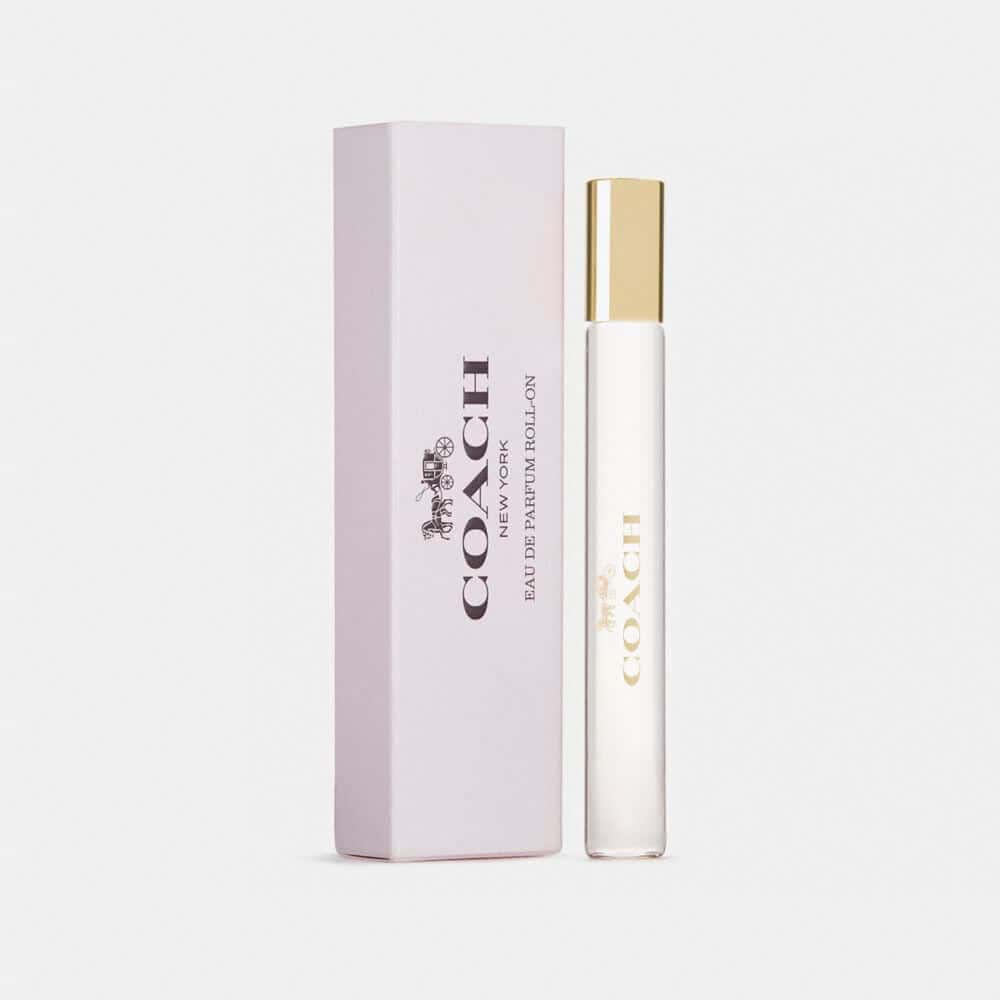 Coach New York Eau de Parfum rollerball in a light-pink and gold travel-sized tube
