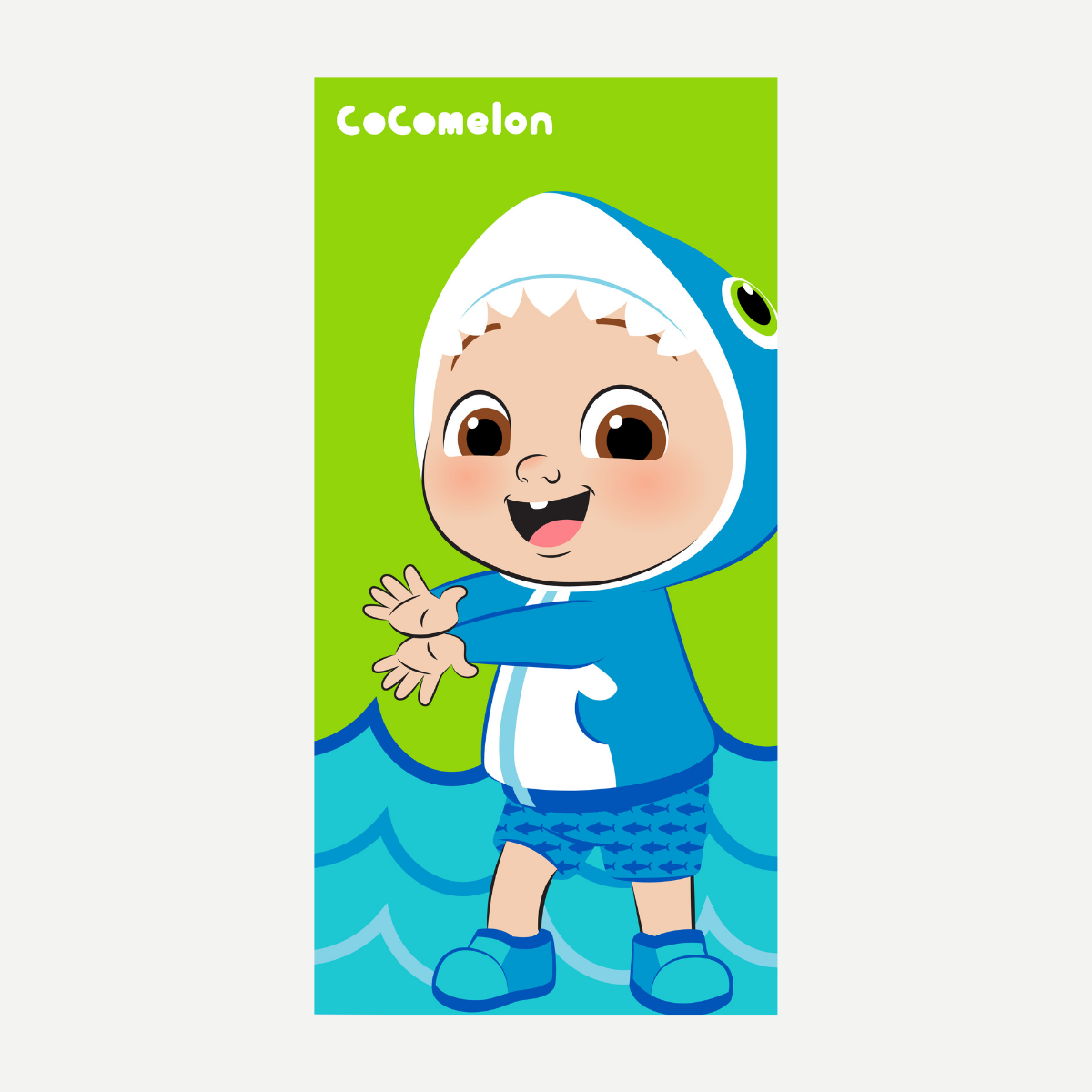Cocomelon beach towel featuring JJ wearing a blue shark costume on a green background with blue waves