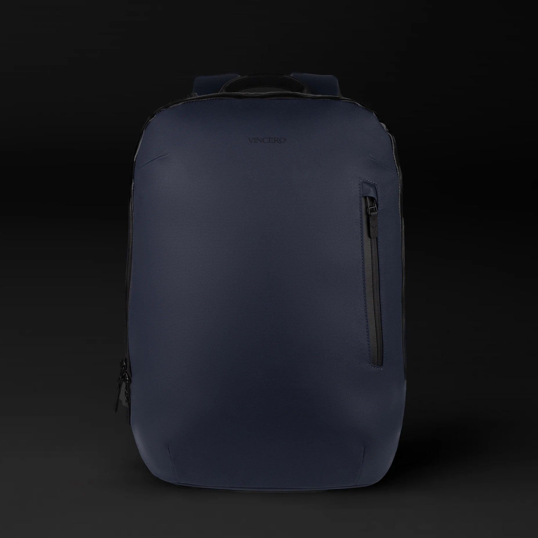 The Commuter backpack in Midnight Blue shown from a side angle, highlighting its sleek urban profile.