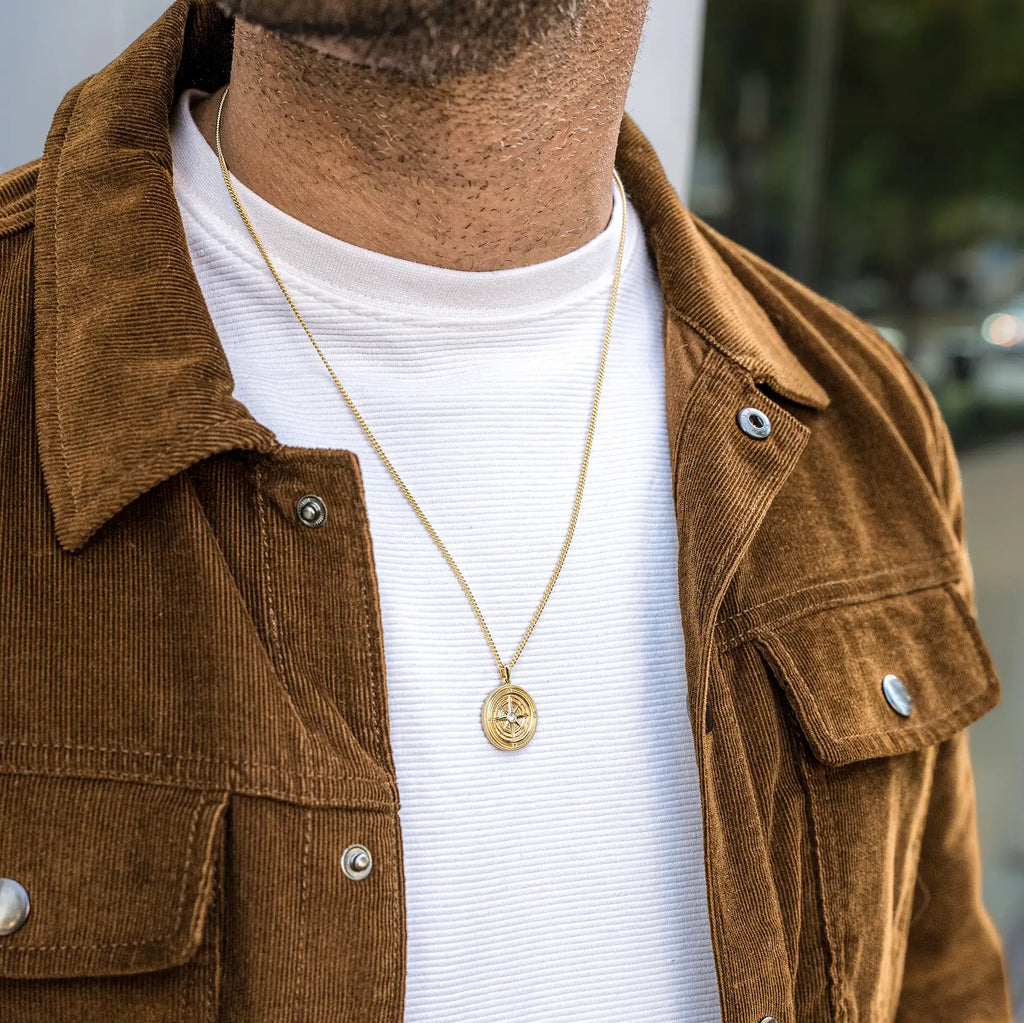 Gold Compass Pendant Necklace with Sapphire Detail