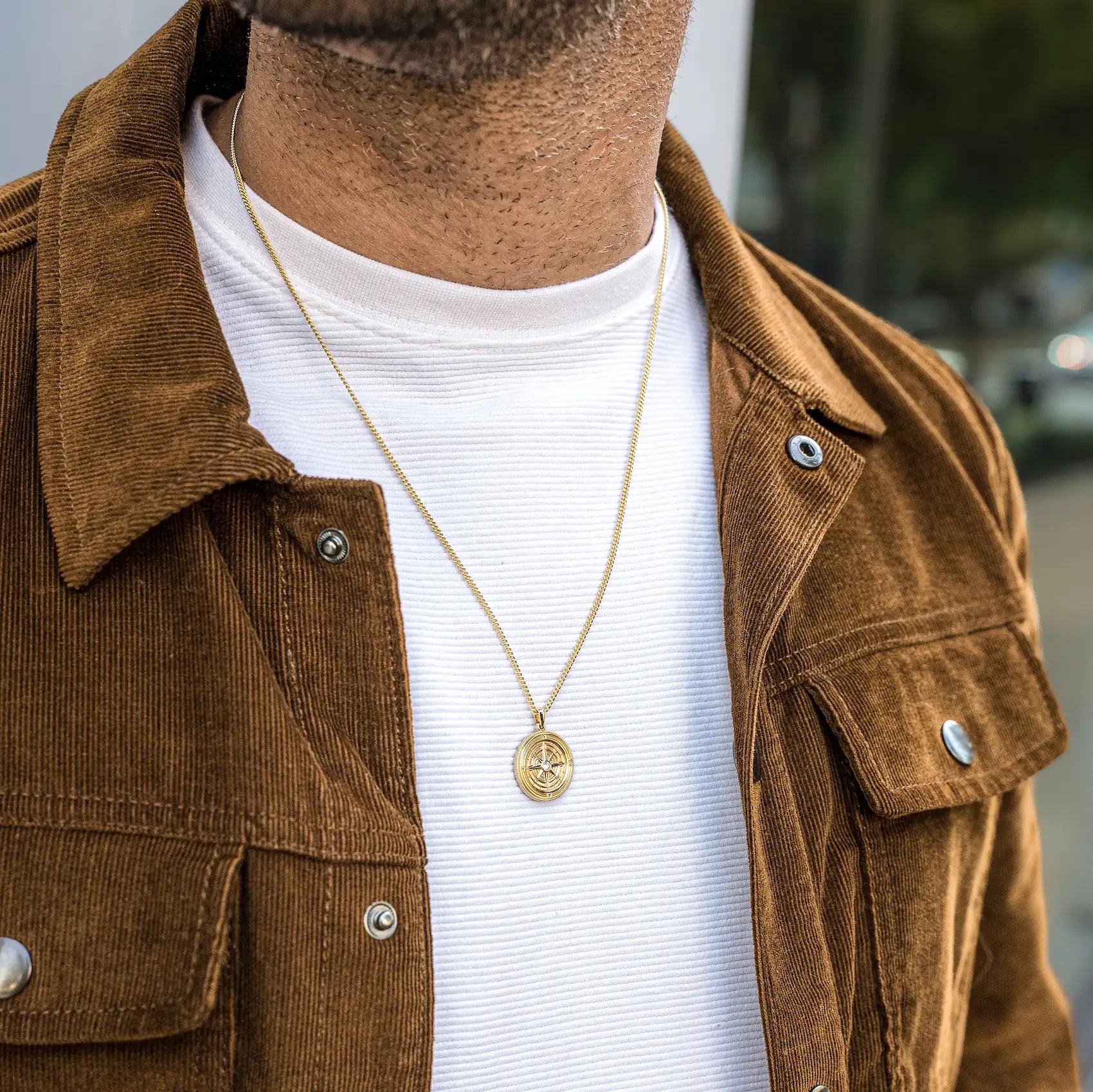 Gold Compass Pendant Necklace with Sapphire Detail