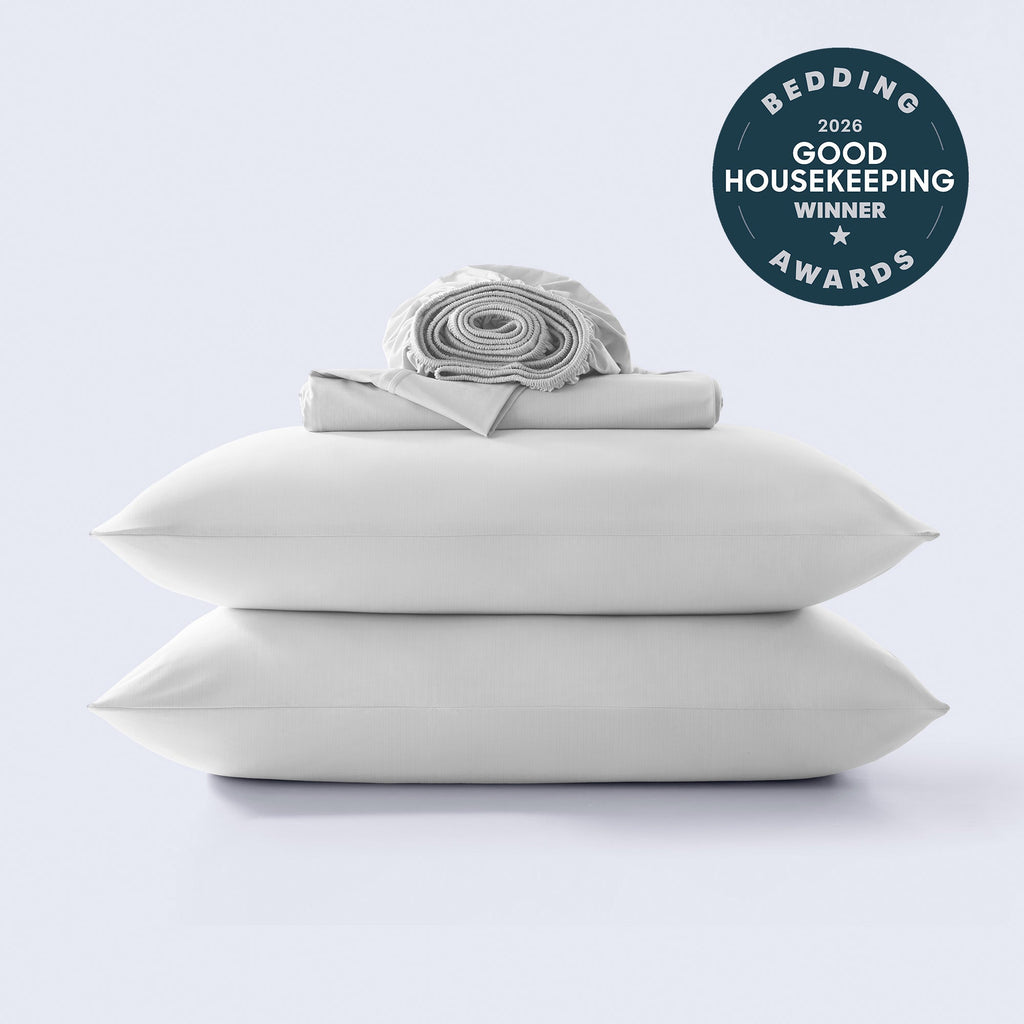 Folded light grey cooling sheet set stack with 2026 Good Housekeeping award seal on clean white background.