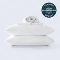 A stack of white cooling sheets with a Good Housekeeping 2026 award winner seal in the corner