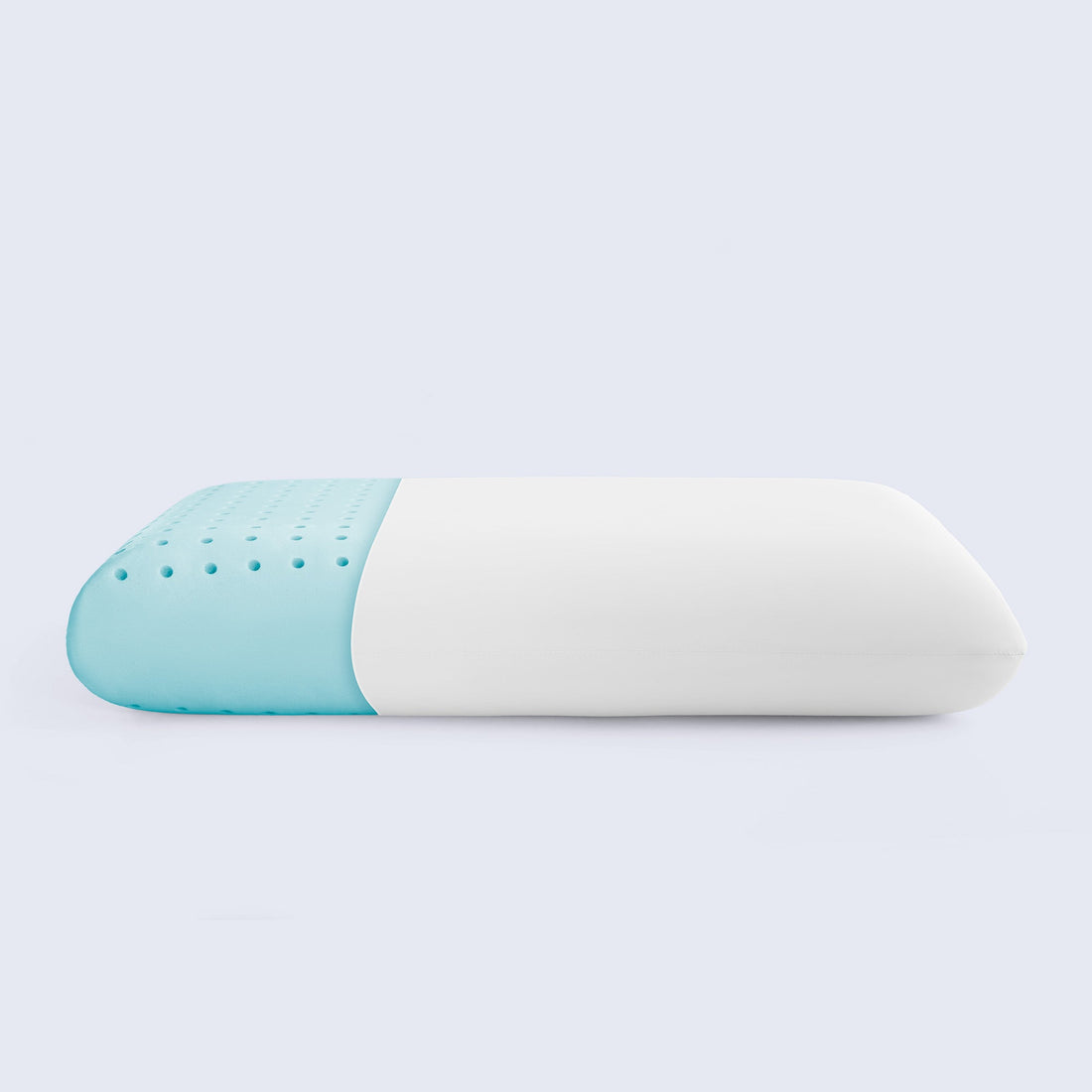 Side view of a white and light blue perforated cooling memory foam pillow