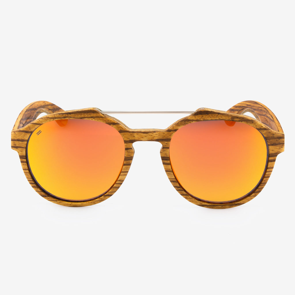 Oversized round Cortez sunglasses featuring a metal brow bar and wood frames.