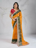 Bright yellow georgette saree featuring digital prints and a contrasting red blouse.