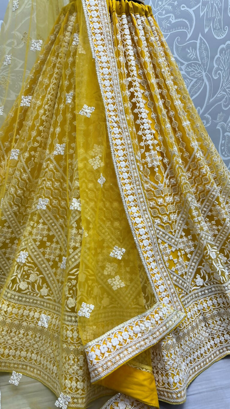 Yellow Net Wedding Lehenga Choli with Sequins and Thread Embroidery