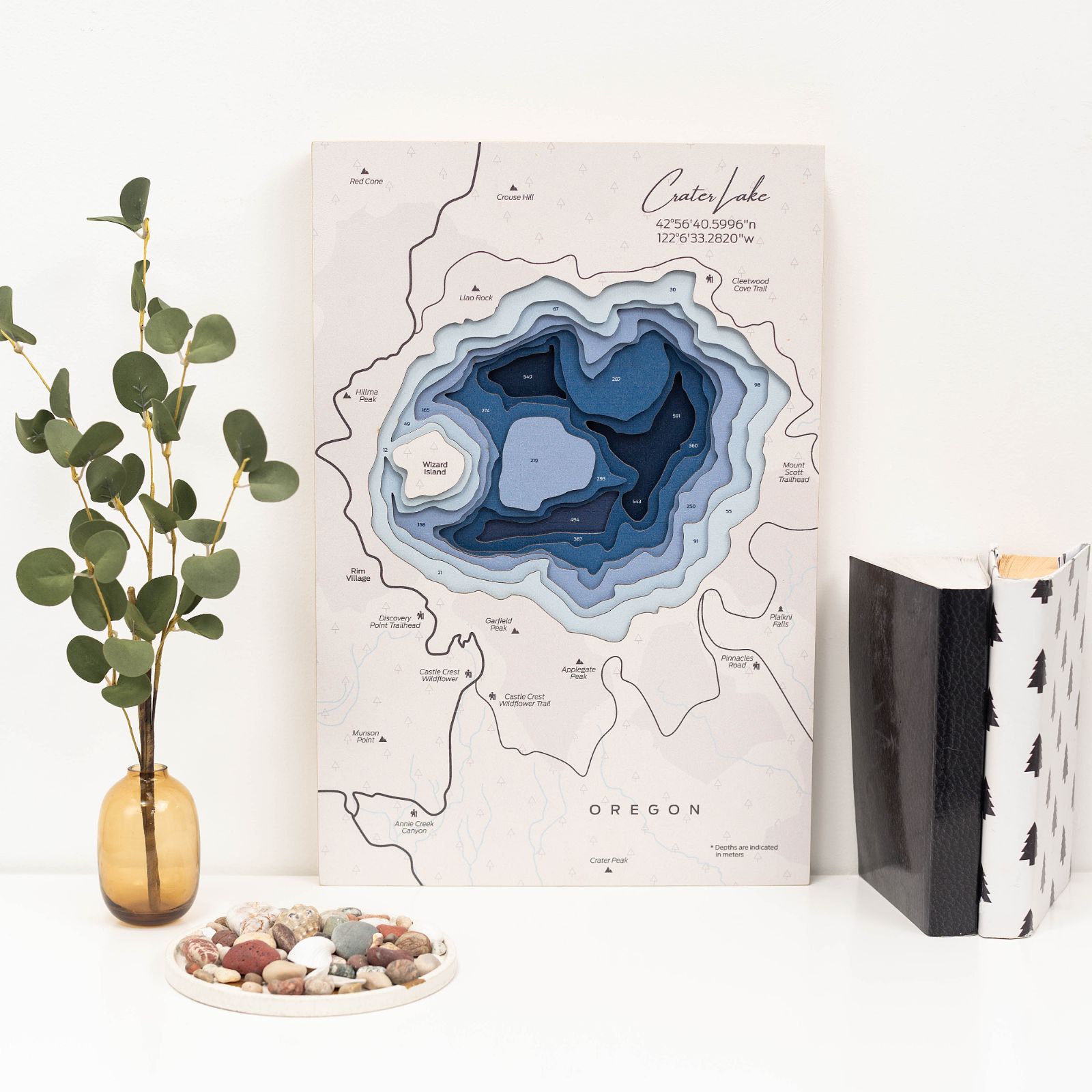 Intricately engraved birch plywood Crater Lake map in blue and tan