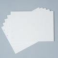 Stack of premium loose leaf photo album refill paper in Creamy White, Craft, and Black